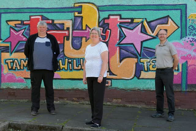 John Hosie, community safety engager for Our Place Camelon and Tamfourhill joins Laraine Sutherland, chairperson of Tamfourhill Tenants' and Residents' Association, and Dan Rous, community coach of Our Place Camelon and Tamfourhill at the Tamfourhill Community Hub