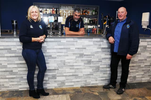 Jennifer McKenna, club treasurer, and sponsor Concept Financial Services; Bill Faulds, club President and Graham Scott, club sponsor GRS Homes