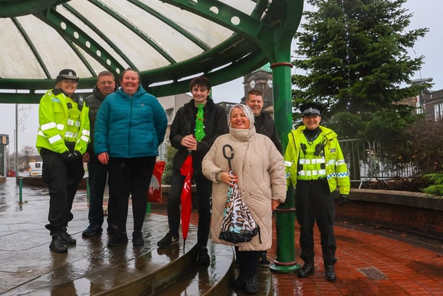 Community Council members, who helped organise the festive celebration, join community police officers at the famous Grangemouth bandstand
(Picture: Scott Louden, National World)
