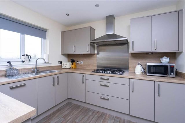 The kitchen has been fully fitted with a wide range of wall and base units, complementary worktops and flooring.