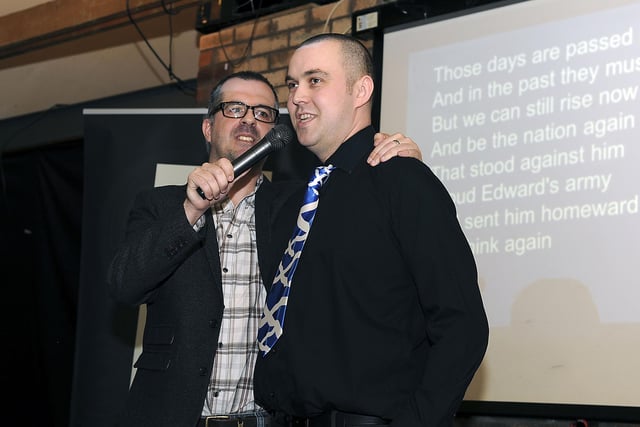 Ewen Cameron and George Dryburgh from Wilkinson singing Flower of Scotland.