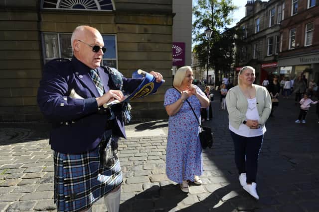 Lanark Town Crier Philip de la Maziere made a special surprise proclamation to mark the 40th birthday of twin sisters Suzie Learmonth and Pamela Gracie. Pic: Alan Murray.