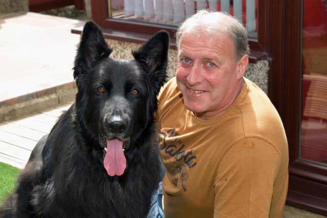 Former police dog handler and inspirational fundraiser Cameron Shanks with his dog Ty