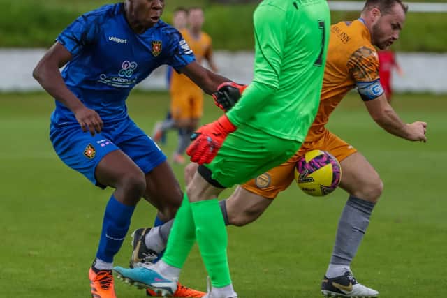 Bright Prince is fouled by Shire goalkeeper Jordan Pettigre, leading to a spot kick for the home side (Photo: Phil Dawson)