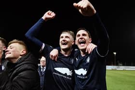 Coll Donaldson and Liam Henderson celebrate after the full-time whistle with the Bairns support