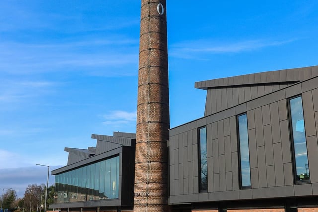 The iconic chimney towers over the distillery building.