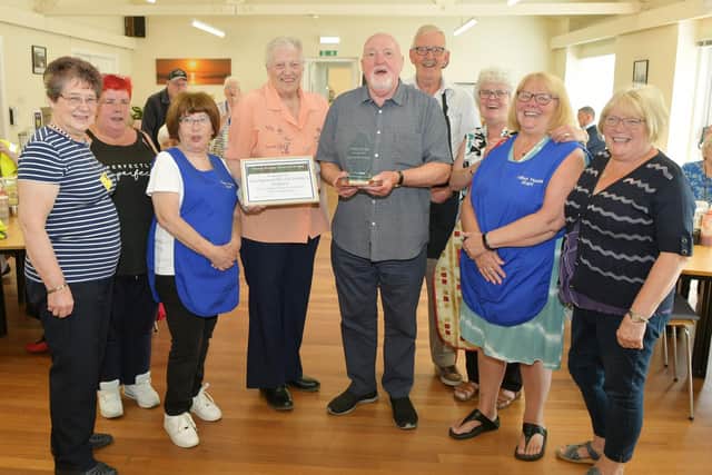 Anne Murphy presents the Jimmy Murphy Memorial Trophy to Talbot House chairman Charlie Greer and the charity's team of volunteers
(Picture: Michael Gillen, National World)