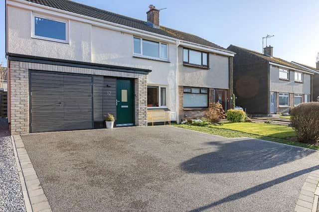 With plenty of room to park your cars, as well as for guests, this is just one of many features that help to sell this pretty home.