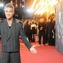 Fans have been urged to follow ScotRail travel advice if they are taking a train to see Robbie Williams in Edinburgh this weekend (Picture: Jeff Moore/PA Wire)