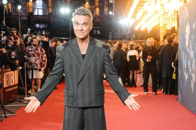 Fans have been urged to follow ScotRail travel advice if they are taking a train to see Robbie Williams in Edinburgh this weekend (Picture: Jeff Moore/PA Wire)