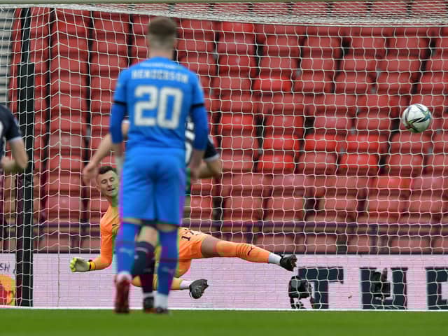 Brian Kinnear is beaten by Billy McKay's early penalty