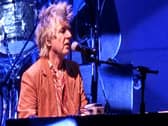 Neil Finn plays the piano for Crowded House