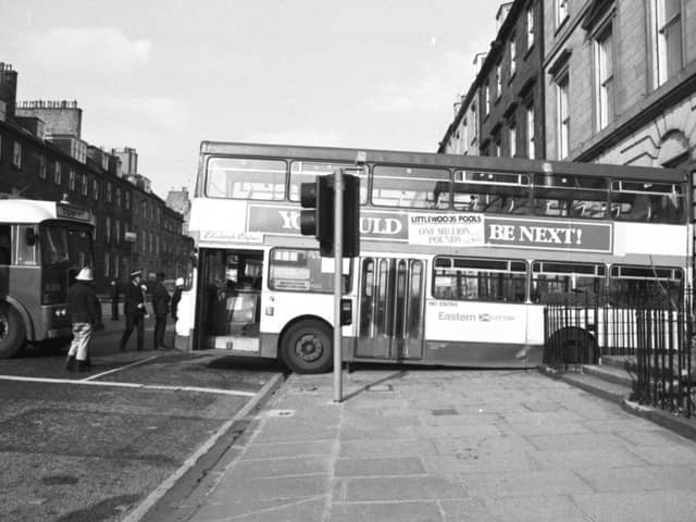 An Eastern Scottish bus rolled backwards, crashing through the railings of a York Place flat in Edinburgh, May 1988   Pic: George Smith