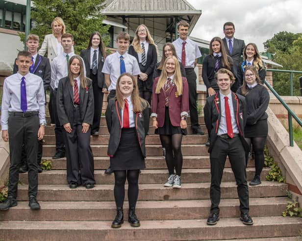 These pupils were celebrating on Tuesday when they received good news about their exams.