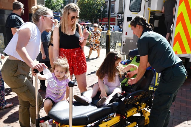Ivy, three, and  Scarlett Amos, four with paramedica Sarah McFadyen