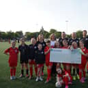 Euan Stainbank alongside Lisa Riley and members of the Dunipace FC girls team. (Pic. Contributed.)