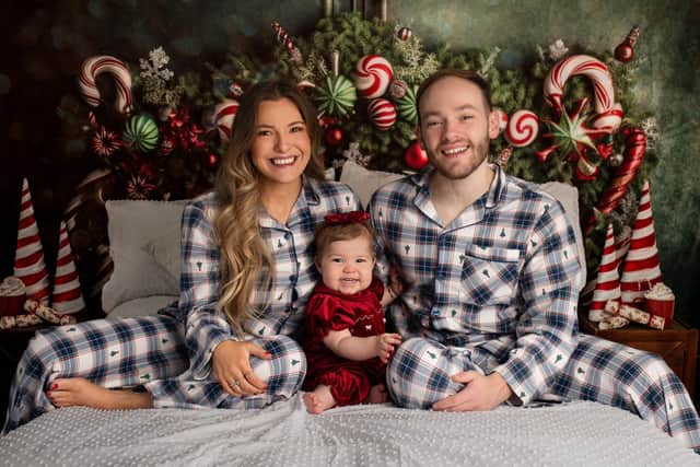 Little Myla Duffey spent her first Christmas in hospital but this year is back home with mum and dad, Laura and Liam. Pic: Andrea Osborne Photography