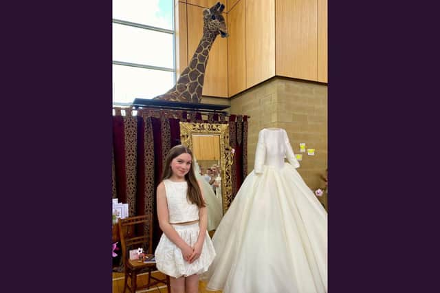 Fair Queen Ella Black with Abigail at her dress showing at Deanburn Primary.