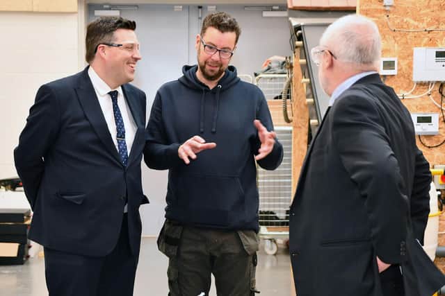 Jamie Hepburn MSP speaking with Steven Adams, Construction Lecturer and Professor Ken Thomson on a tour of the campus during the opening celebrations.  Picture: Michael Gillen.