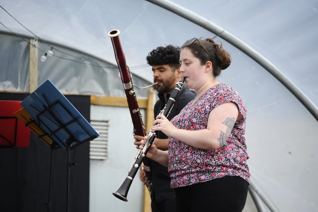 Nevis Ensemble playing in a poly tunnel.
