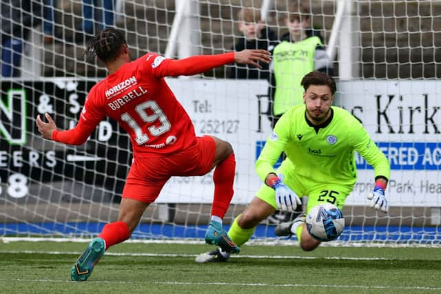 Substitute Rumarn Burrell goes for goal in the second half