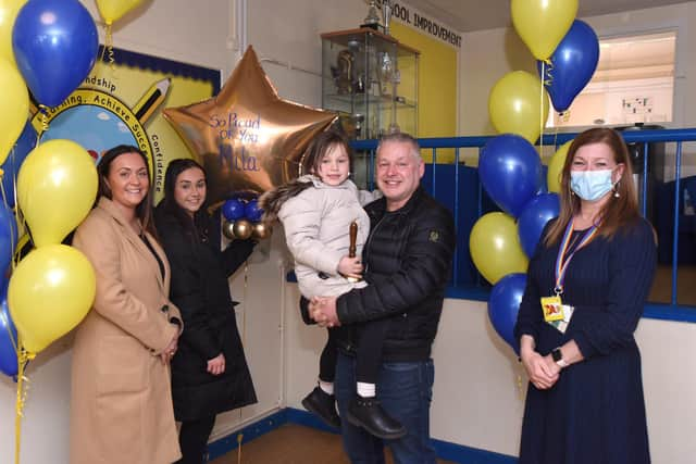 Mila Sneddon, 6, in remission from acute lymphoblastic leukaemia. At Stenhousemuir Primary School with left to right, mum Lynda, sister Jodi, dad Scott and head teacher Dawn Stanfield