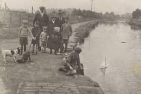 A group of adults and children on the Union Canal towpath, 1920.