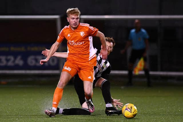 Summer signing Callum Sheridan drives forward in possession