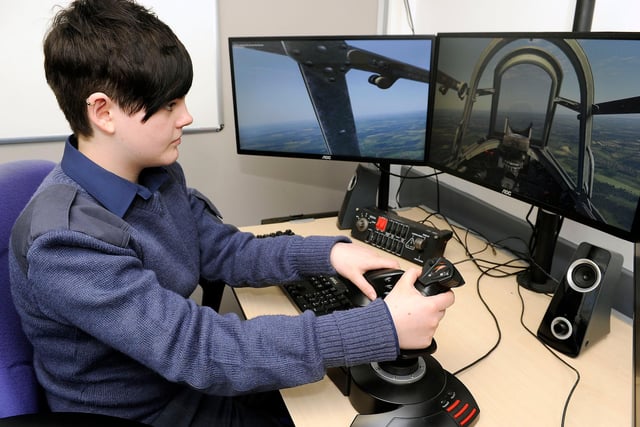 Erin Falconer (13) tries out the flight simulator in 2015.