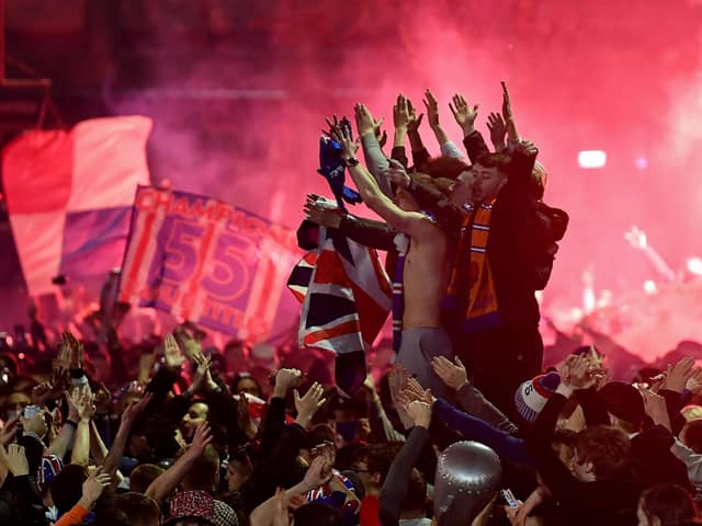 Rangers fans gather in George Square to celebrate the club winning the Scottish Premiership for the first time in 10 years (Photo by Jeff J Mitchell/Getty Images)