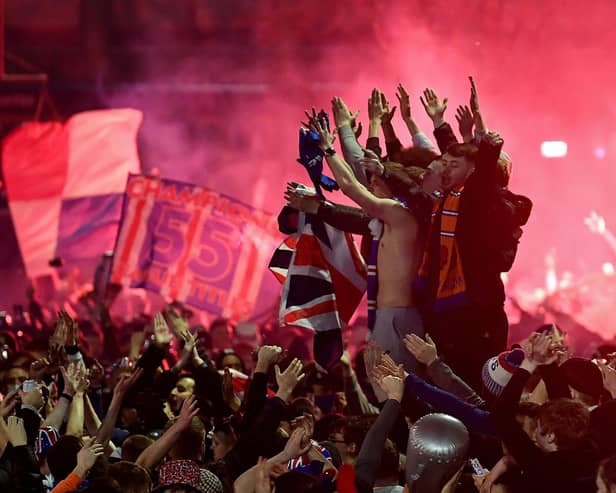 Rangers fans gather in George Square to celebrate the club winning the Scottish Premiership for the first time in 10 years (Photo by Jeff J Mitchell/Getty Images)