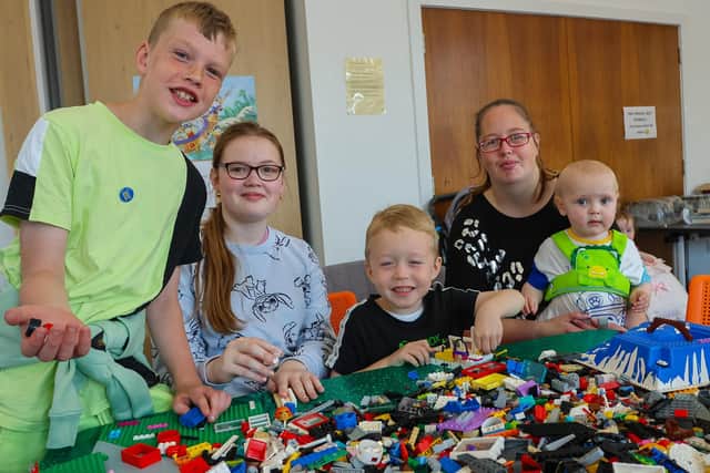 Perhaps one of these youngsters who recently attended an event at Denny Library and did some Lego model building would like the job? Left to right, Calvin, 10, Lily-Rose, 12, William, 6, and Ashleigh with Edward, 18months. Pic: Scott Louden