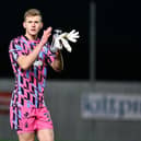 Falkirk goalkeeper Nicky Hogarth applauds the home support in the Kevin McAllister Stand (Photo: Michael Gillen)