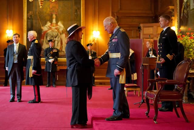 Barbara Rae is made a Dame Commander of the British Empire by King Charles III during an investiture ceremony at the Palace of Holyroodhouse. Pic:Jane Barlow/PA Wire