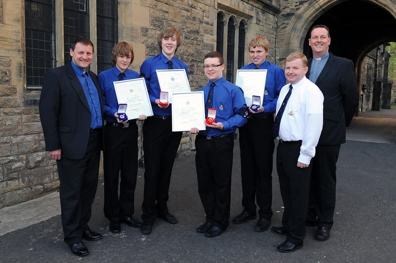 In 2010 4th Falkirk Boys' Brigade had a presentation to two Queen's badge and two President's badge recipients. Left to right, Rev. David Anderson Black Watch chaplain presenting prizes, Greg Neary, 15,  President's badge; Dale Maxwell, 16, Queen's badge; Alexander Walker, 16, Queen's badge; Jamie Bowman, 15, President's badge,Captaiin Stuart Frampton and Rev. Robert Allan.