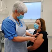 Dorothy Bell, head of occupational health, receives the vaccine from Hilary Nelson, ICU critical care nurse and Royal College of Nursing steward for NHS Forth Valley. Picture: Michael Gillen.