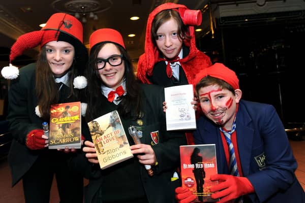 Pupils Morgan Meldrum, Clare Campbell, Andrew Stowe and Jessica Donaghie each holding a short-listed book for 2012.