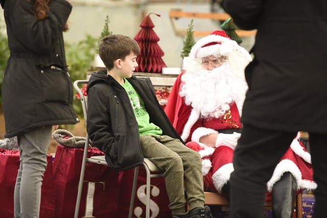 Robbie Foltier (9) meets Santa at the STS Christmas event on Saturday.  (Pic: Alan Murray)