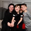 Mum Jodie Murphy with sons Frazer and Robbie is campaigning for inclusion for wheelchair users. Picture: Michael Gillen