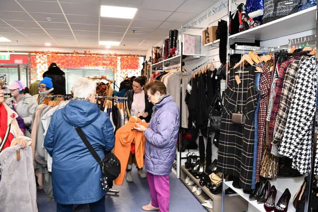 Eager customers in the new Strathcarron Hospice charity shop in the Howgate. Pic: Michael Gillen