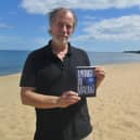 Author Torquil MacLeod on Anita's holiday beach for the launch of the fourth book in the series, Midnight in Malmo