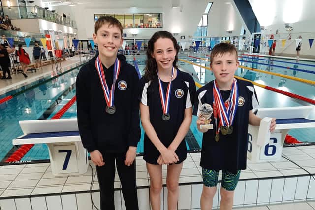 Falkirk Otter swimmers Kyle Rawding, Lucy Ure and Zachary Dormer at the Dunfermline meet (Photo: Contributed)