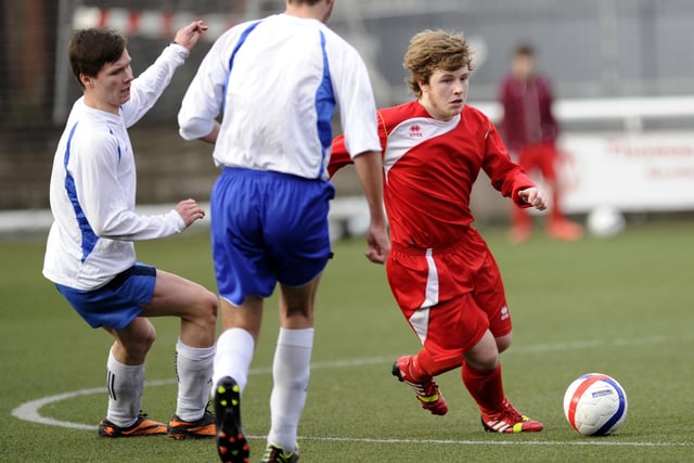 Larbert HS player drifts away from Graeme HS opponent.