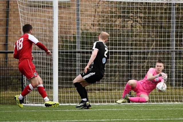 Zander Gilchrist makes a save for Dunipace against Coldstream