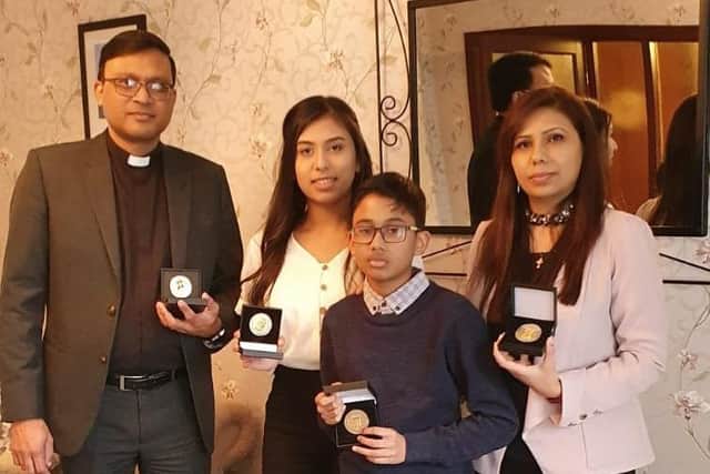Rev Raheel Arif of Denny Old Parish Church, his wife Humaira and their son, Rhea and daughter, Roshaan, gain UK citizenship