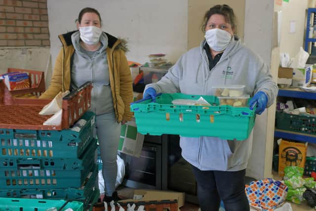 Kersiebank Community Project has handed out food parcels to vulnerable families, households in isolation and the elderly. Angela Bradley, treasurer, and Lorna Rothwell, committee member. Picture: Michael Gillen.