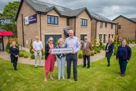 Elizabeth Grubb with her son Rhoderick and daughter Mhairi with Councillor Kevin Lang, Councillor Louise Young, Keith Gimlett (QDCC) and Taylor Wimpey sales executives Jacquie Bryson Elder and Helen Allenby. Photo - Chris Watt