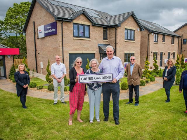 Elizabeth Grubb with her son Rhoderick and daughter Mhairi with Councillor Kevin Lang, Councillor Louise Young, Keith Gimlett (QDCC) and Taylor Wimpey sales executives Jacquie Bryson Elder and Helen Allenby. Photo - Chris Watt