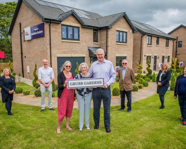 Elizabeth Grubb with her son Rhoderick and daughter Mhairi with Councillor Kevin Lang, Councillor Louise Young, Keith Gimlett (QDCC) and Taylor Wimpey sales executives Jacquie Bryson Elder and Helen Allenby. Photo - Chris Watt