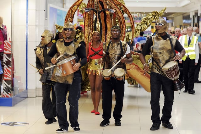 Dance group parades through the Howgate.